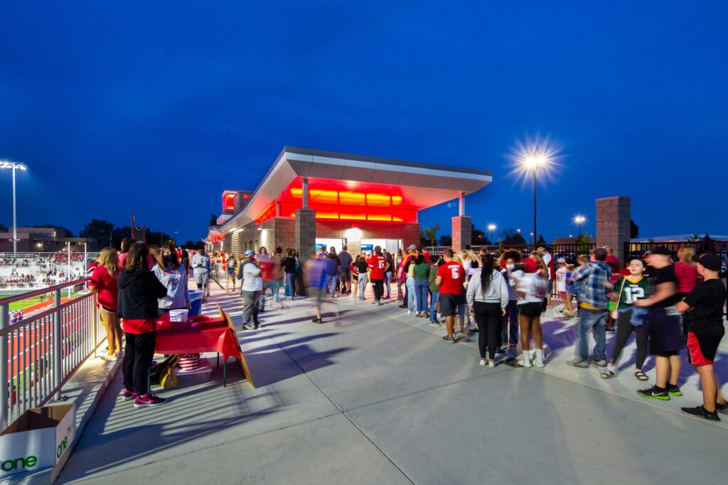 Spectators lined up for concessions at dusk