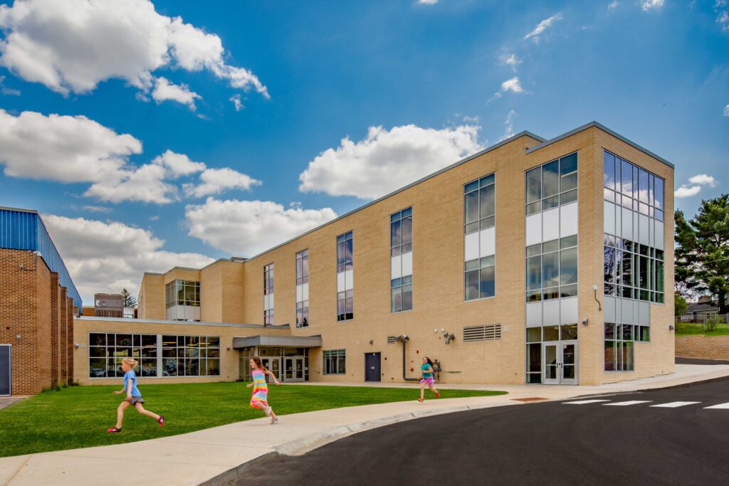 External view of a windowed three-story addition to Belleville Intermediate School