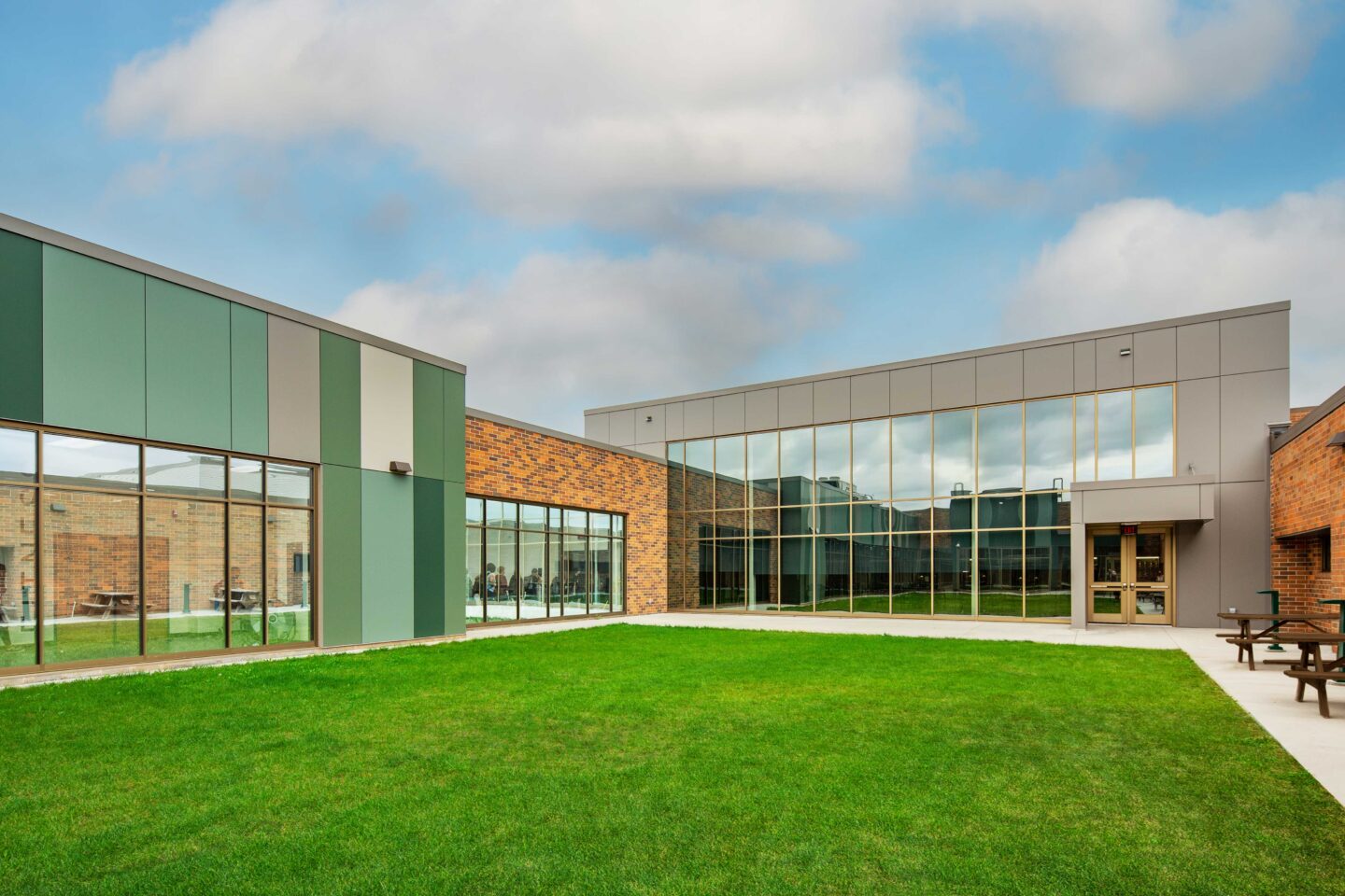New and renovated spaces surround a grassy courtyard at Fall Creek High School