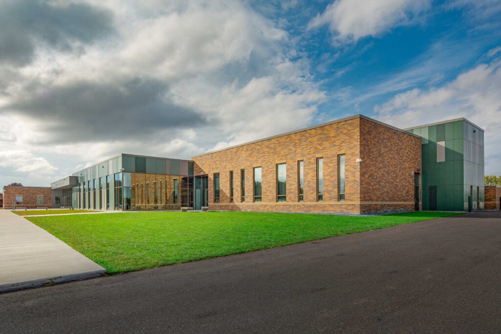 An exterior view shows how modern, new parts of the building join with renovated spaces at Fall Creek High School