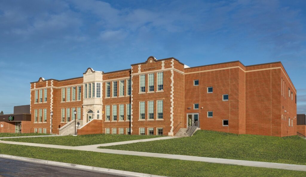 An exterior view of Florence Middle + High School shows the blending of the historic building with additions