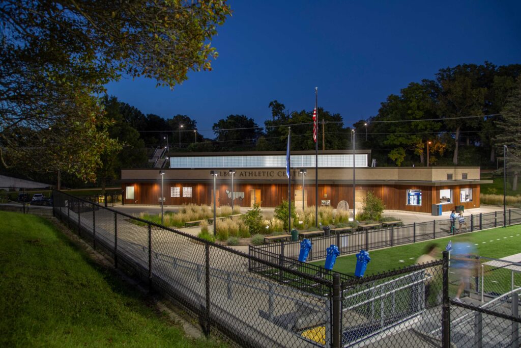 Wide view of the athletic center building and the plaza leading to the field