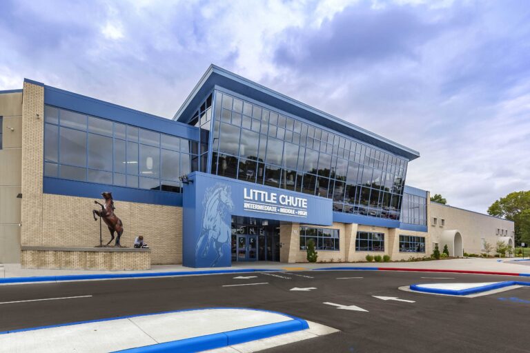 Exterior view of the new entrance for the Little Chute Intermediate, Middle, and High school, which features soaring windows above an entrance decked out in school colors