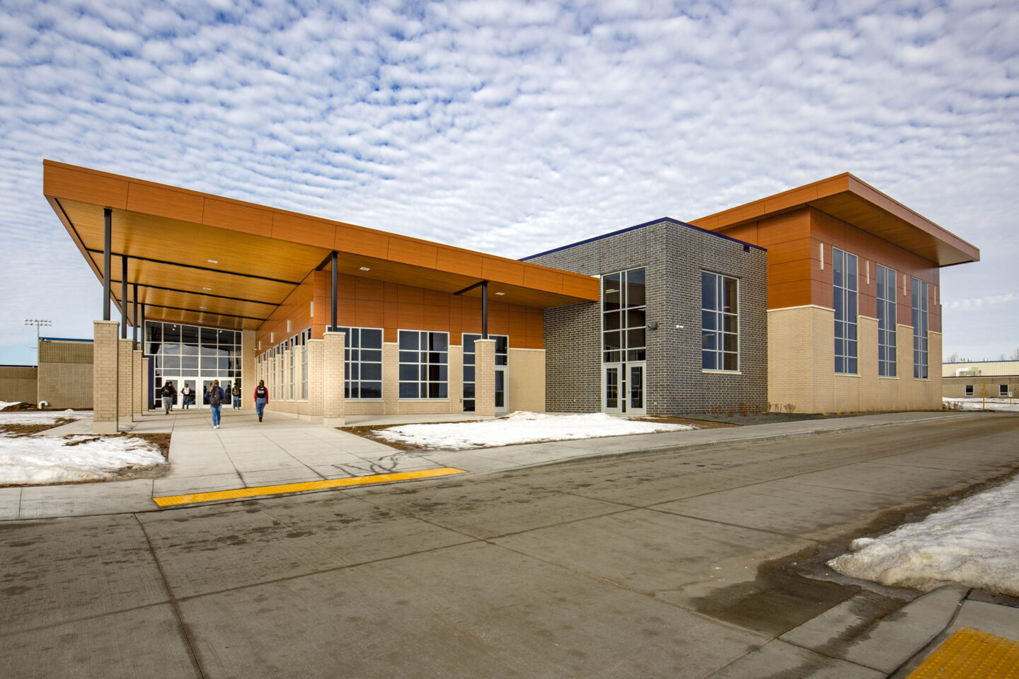 Exterior view of a newly renovated addition and entrance at the combined campus of Northern Ozaukee School District