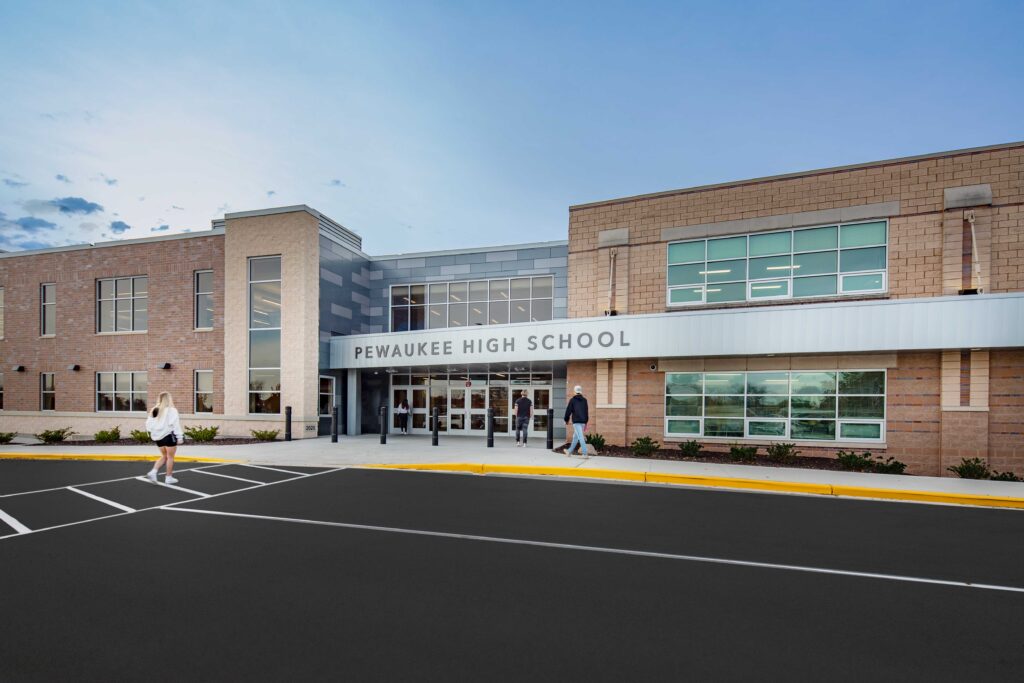 Wide exterior view of an updated entryway at Pewaukee High School