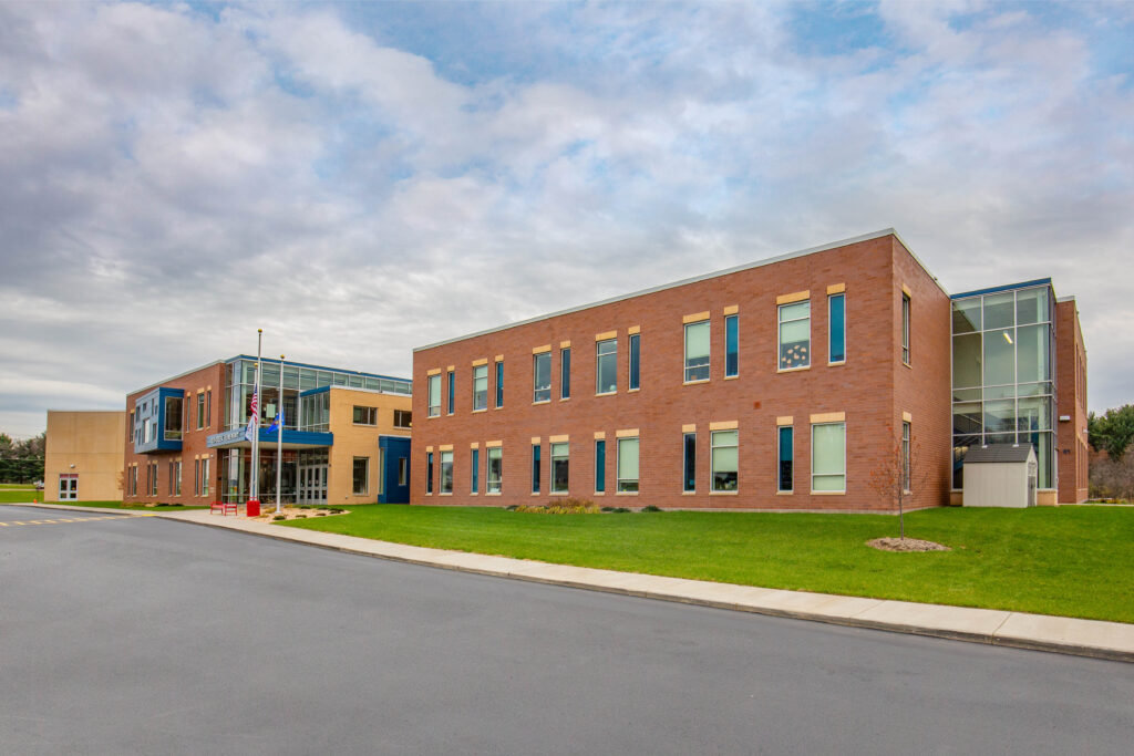 An exterior photograph, including the school's main entry