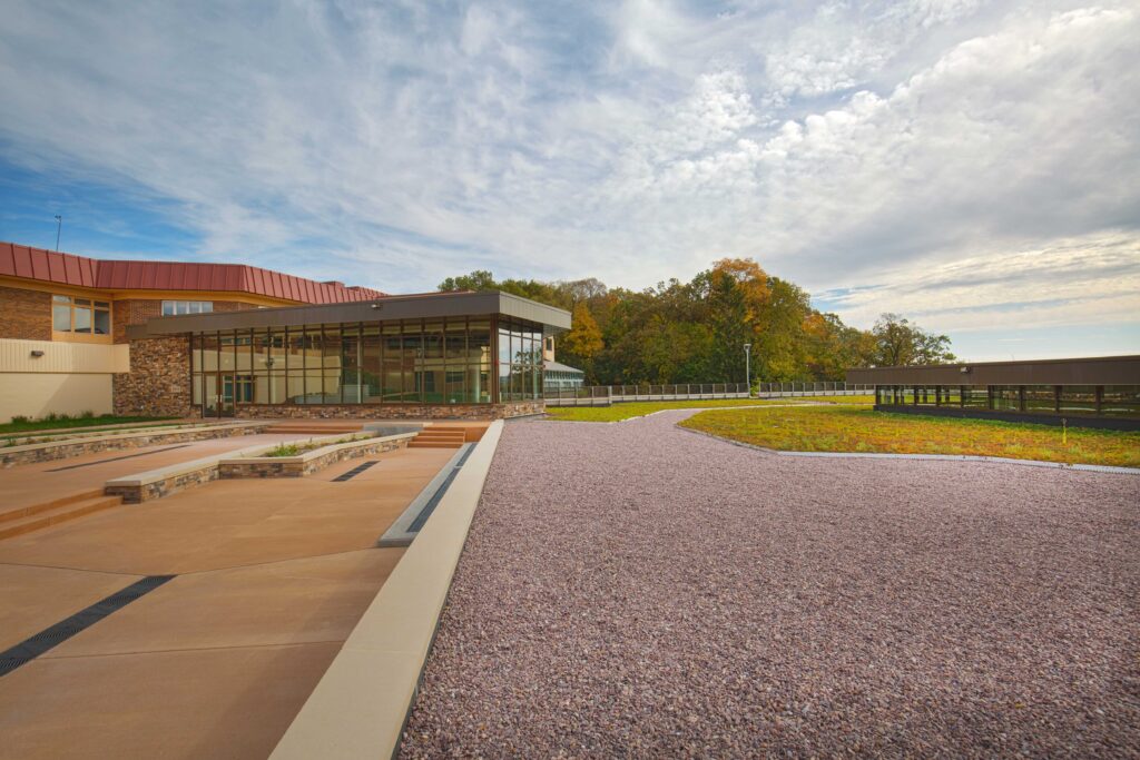 A broad view of the new building blending into the colors and elevation of the surrounding landscape