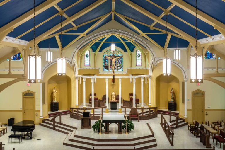 Wide view of church interior from above in the rear loft