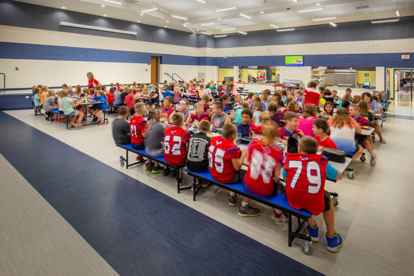 The cafeteria at Allenton Elementary features a raised platform for student performances and guest speakers