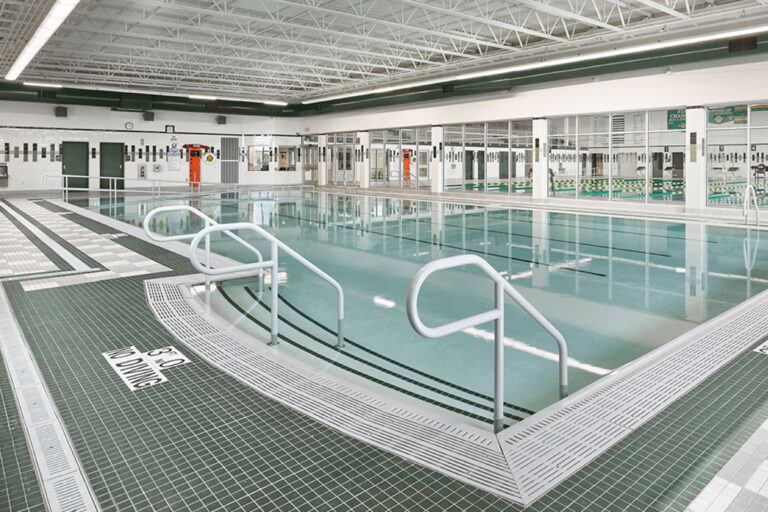 Corner view of the stairs leading into a warm-water pool