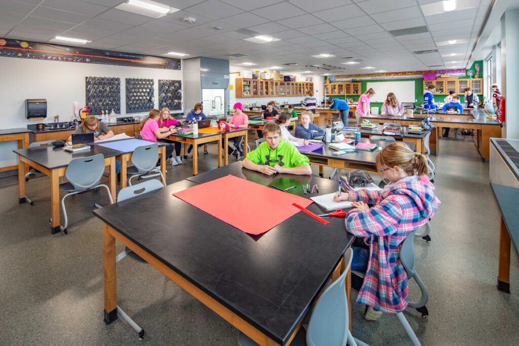 Lab tables of various sizes, equipment storage, and natural light give students working at Coleman High School a flexible space for science learning