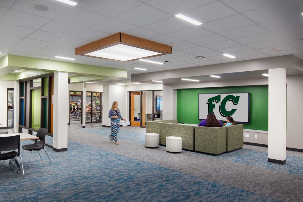 Students walk through and gather at seating areas designed to promote collaboration at Fall Creek High School