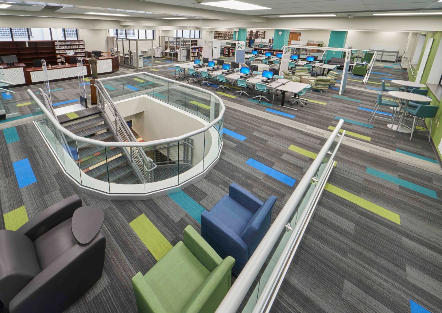 Wide view of colorful furniture and finishings in an updated library space