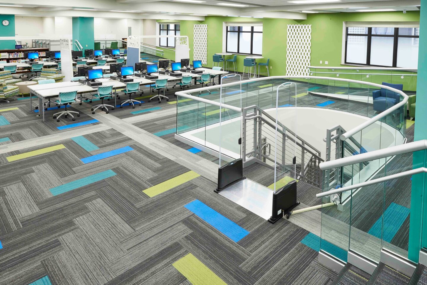 Wide view of colorful furniture and finishings in an updated library space