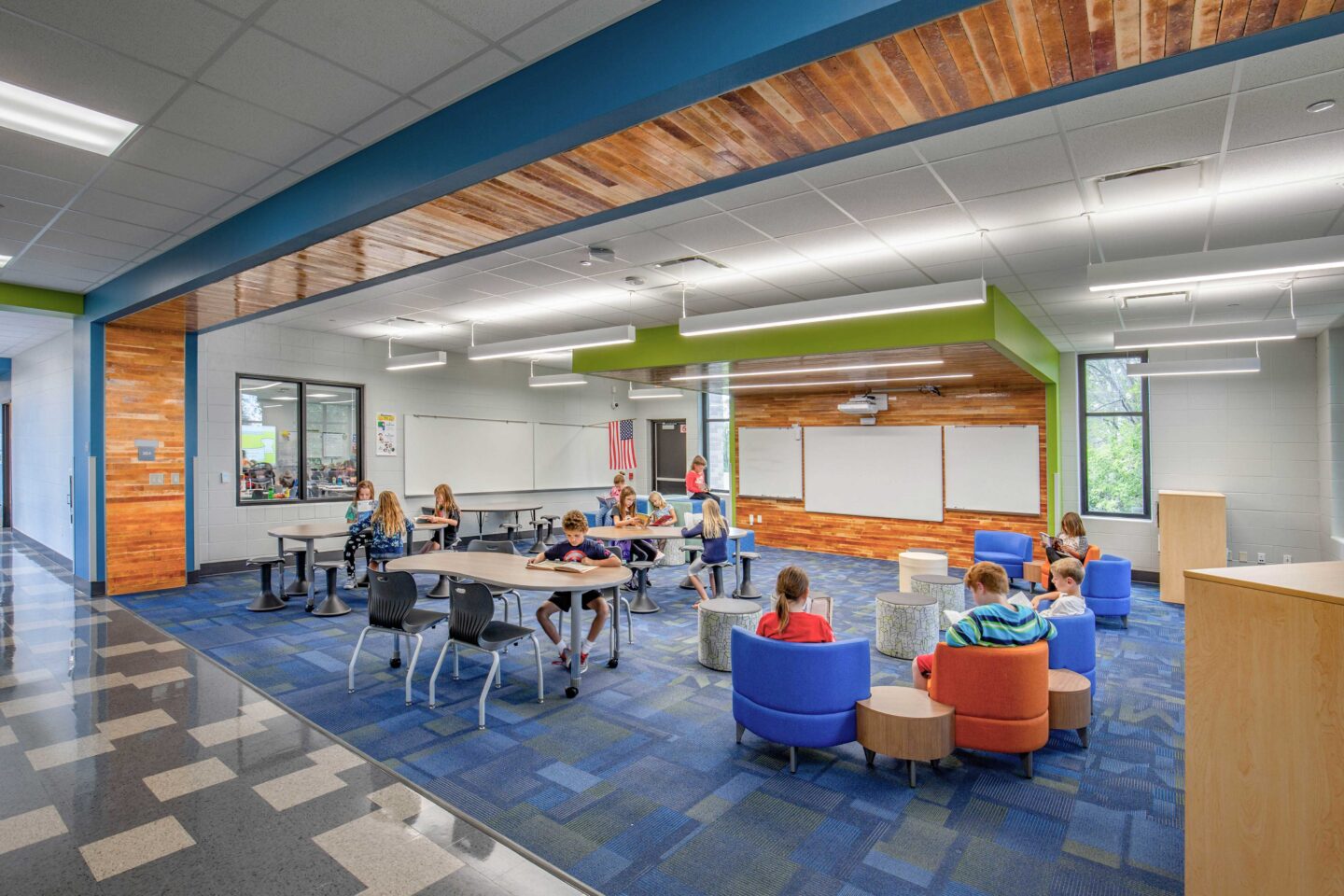 Resource areas with a view of the adjacent classroom via a window between the spaces.