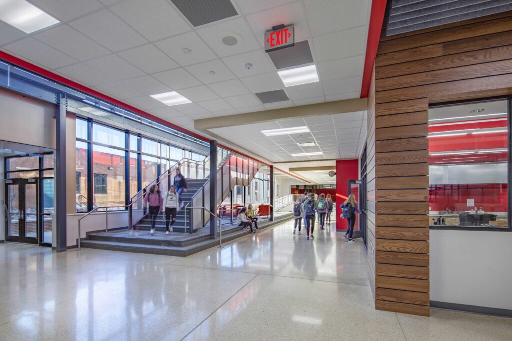 A view of the art commons, including the lounge space located under one of the school's main circulation staircases