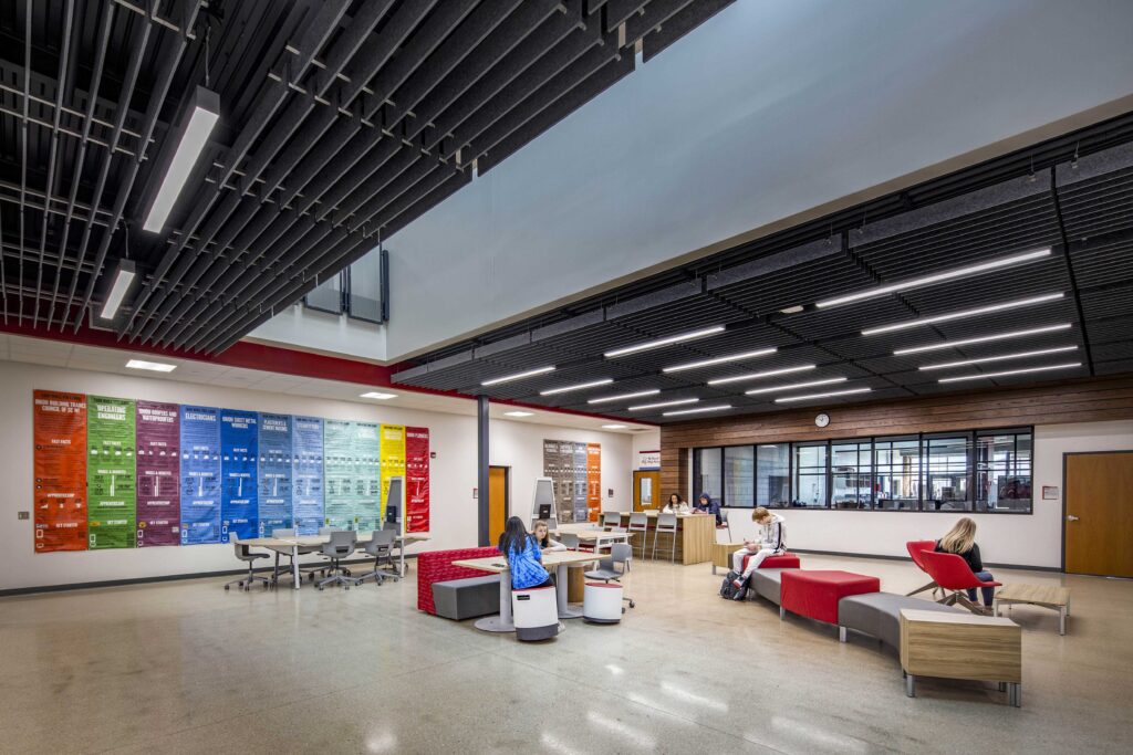 Students study in the tech ed commons area, which features a large atrium