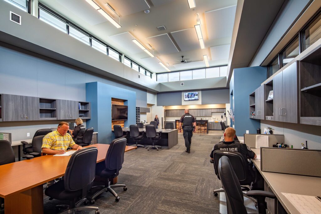 Blue accent walls mark a police break area