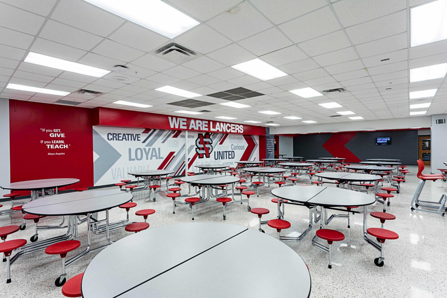A view of the cafeteria featuring an environmental branding installation in the background