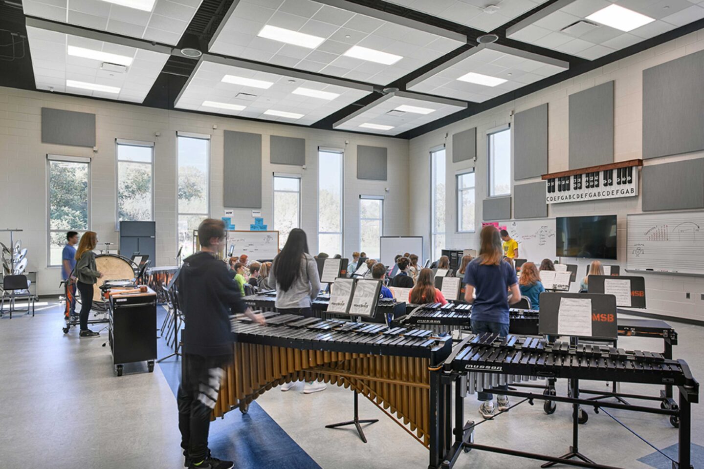 Students rehearse in the renovated music room, which features acoustic tiling and plenty of windows for daylight