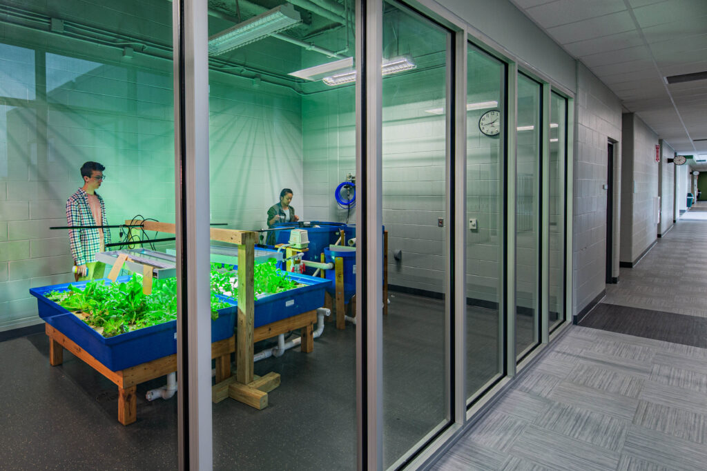 high school aquaponics room with glass sliding doors