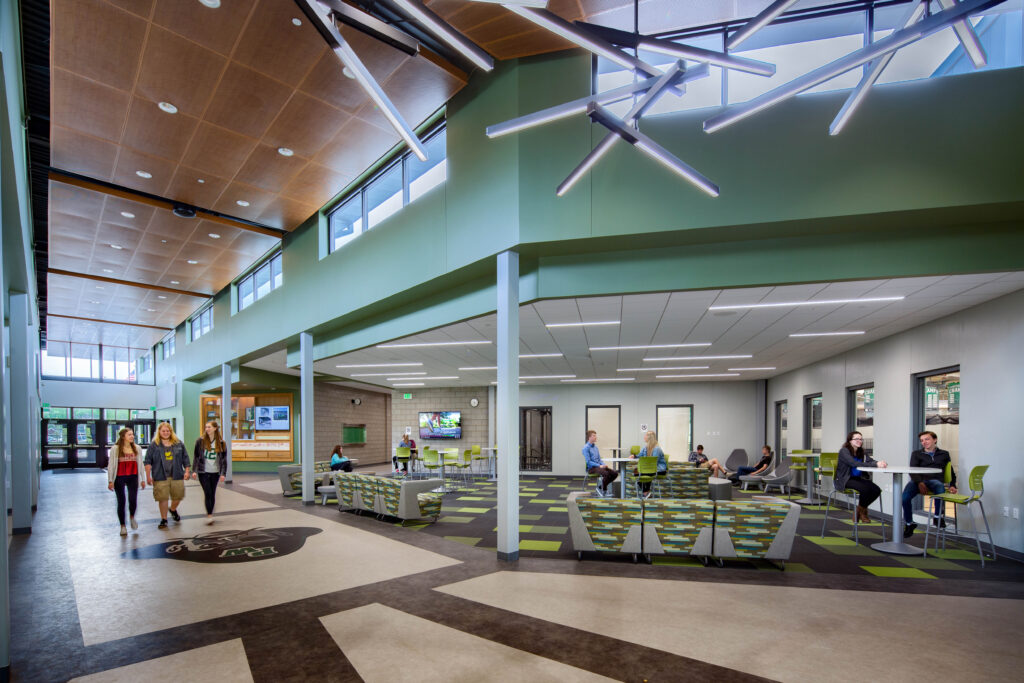 Students interact in the Port Washington High School commons area.