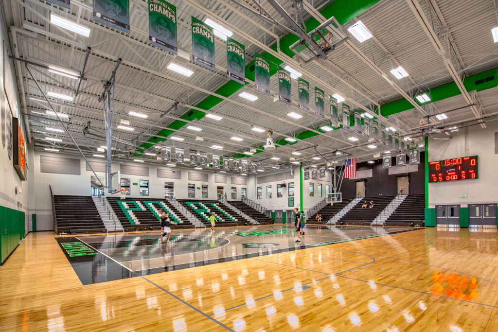 A view of the basketball court and extended bleachers in the new gymnasium