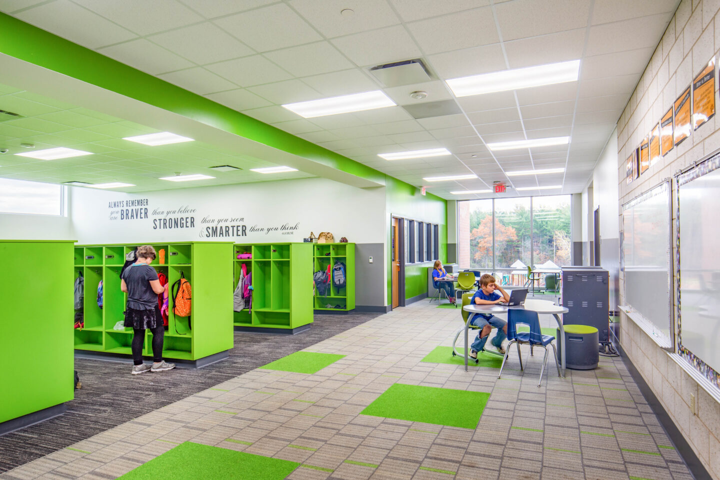 Collaboration areas with white boards act as extension of the classrooms for group breakout sessions