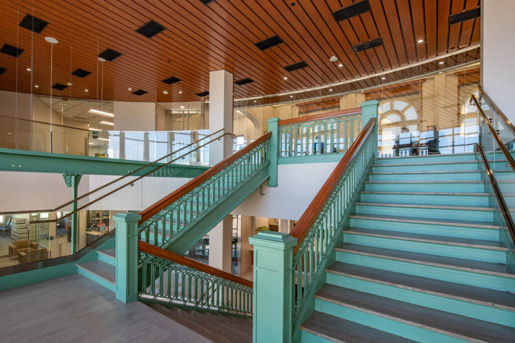 A historic split staircase sweeps up from a large atrium in Sheboygan City Hall