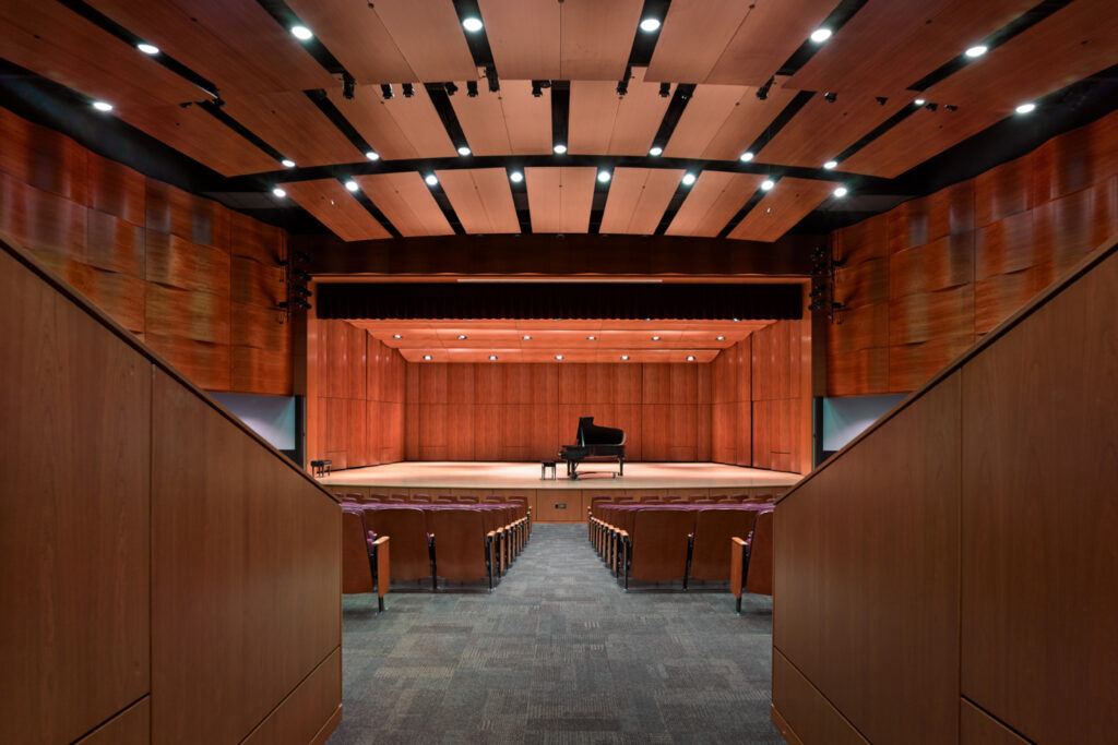 View from the center back of a large, wood-paneled concert hall