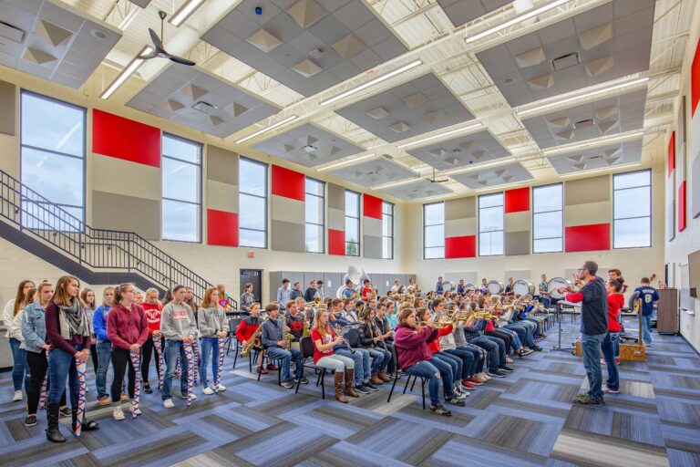 The school band and color guard rehearse in the band room, which features large windows for ample daylighting