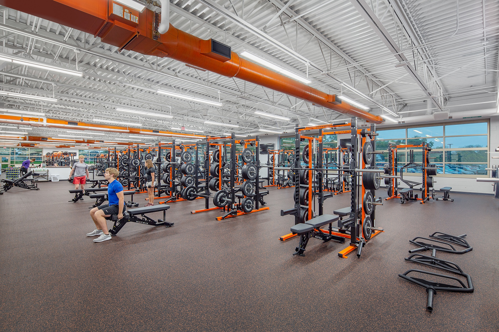 A view of the school's new fitness center featuring large windows in the background