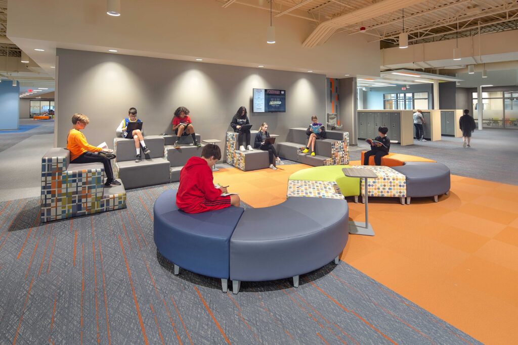 Students use the flexible furniture at one of the collboration areas