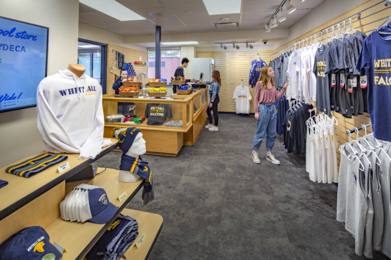 A student browses school-themed gear at the Whitnall High School spirit shop