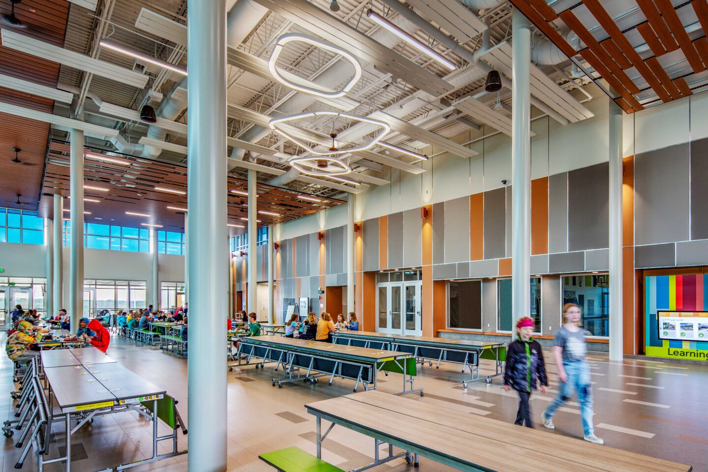 Cafeteria featuring ceiling panels with circle lights