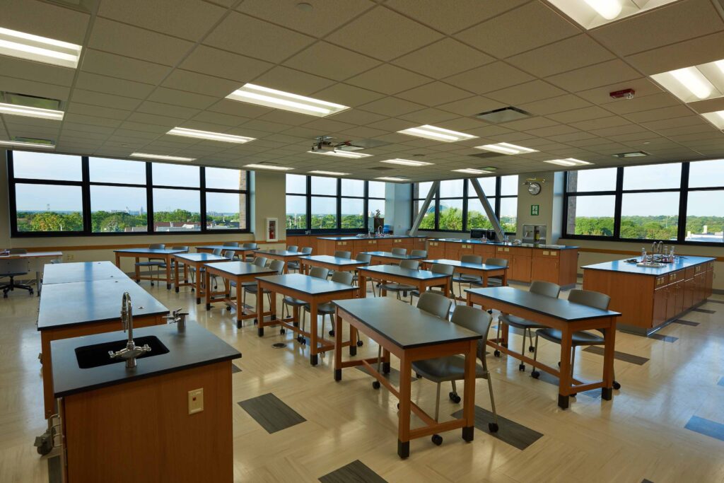 A view of a science classroom with large windows that provide views and natural light