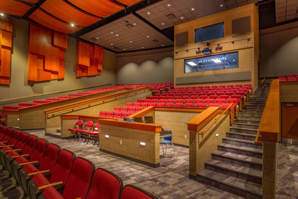 A view of the sound booth standing from the center of the auditorium