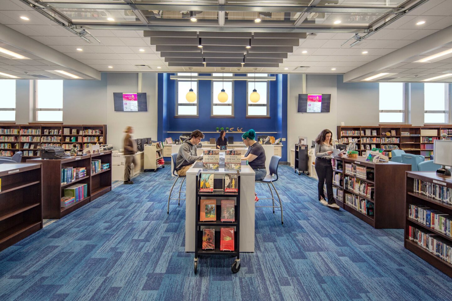 Library entrance with garage door open and front desk visible