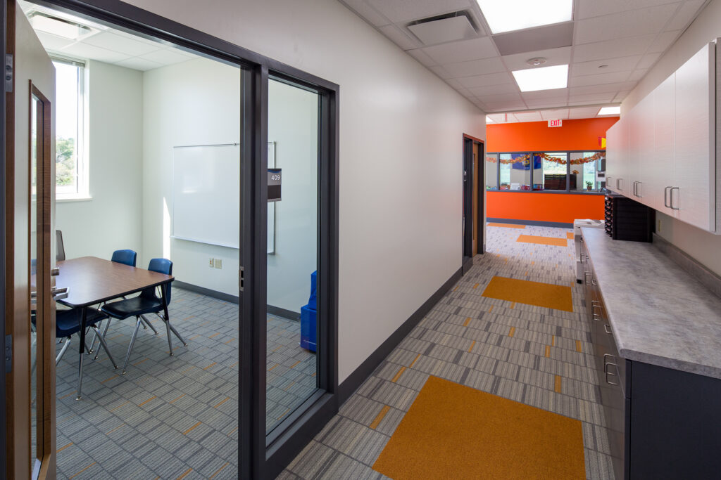 A conference room at Red Creek Elementary School provides collaboration space for district staff and quiet areas for focused work.