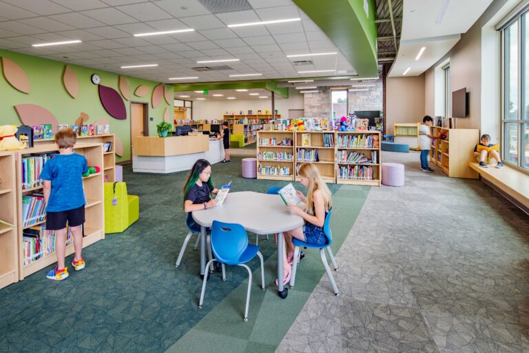 Baird Elementary School library with children reading books