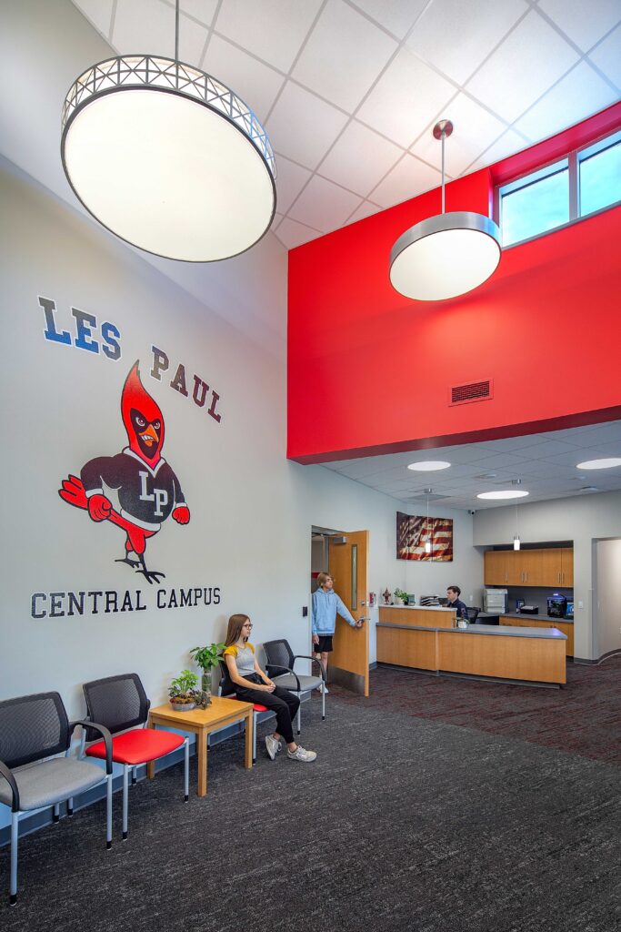 A view of the school office at Les Paul Middle School, including a large environmental branding graphic of the school mascot.