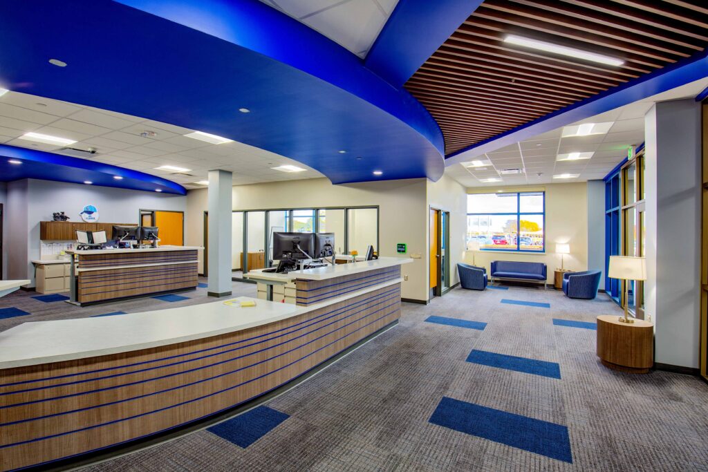 Soft lighting, windows, and comfortable furniture help make the office comfortable for students and visitors.