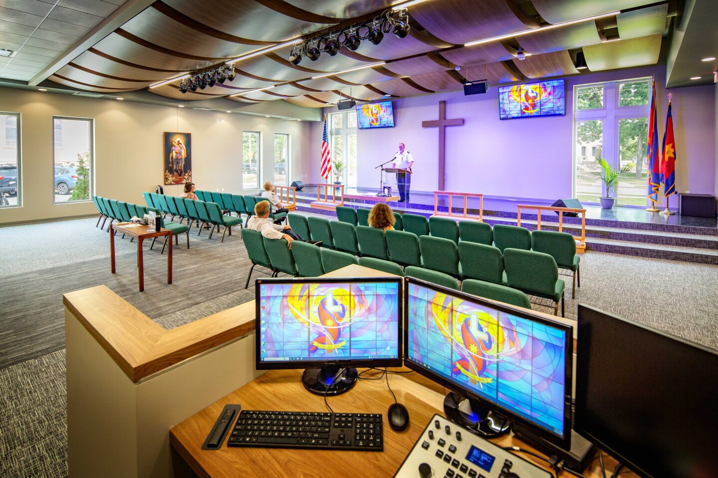 Salvation Army Oshkosh Auditorium Chapel with a speaker and people listening