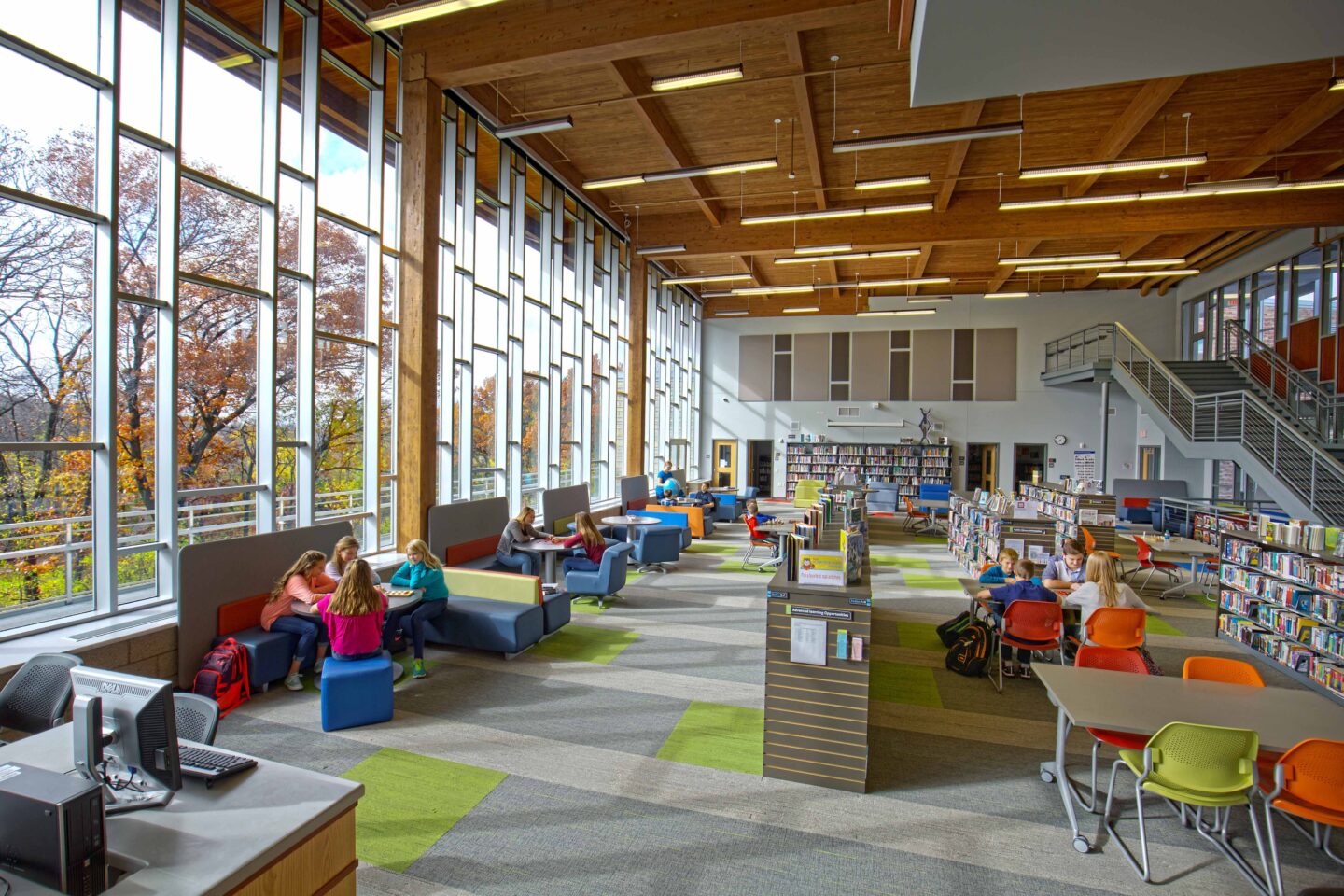 The library features large windows that overlook the nearby conservancy.