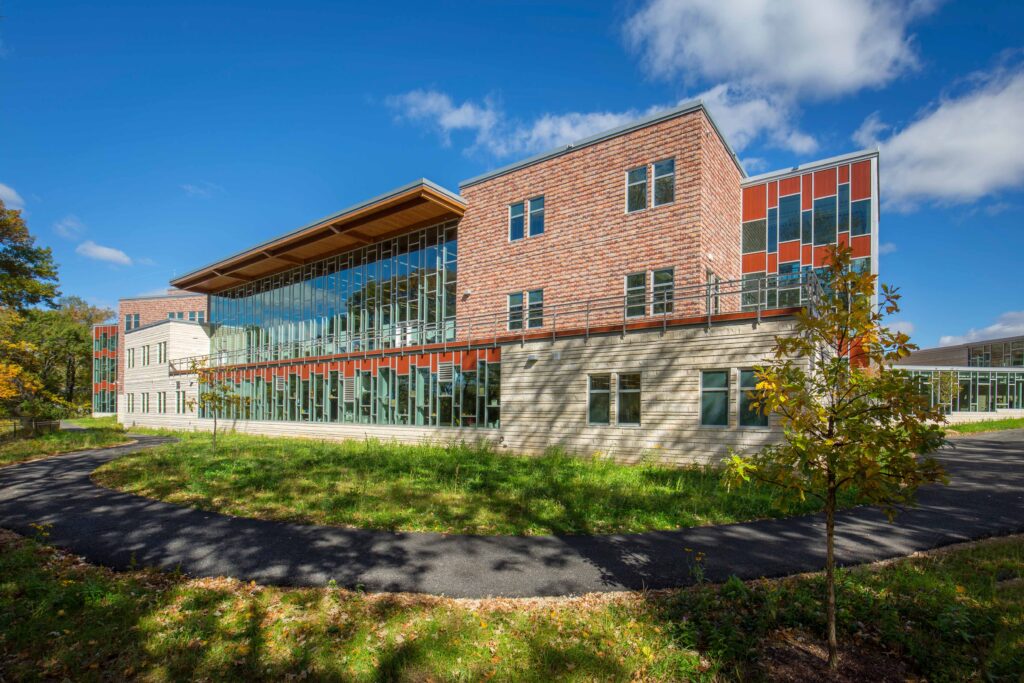 A view of the school featuring a walking path in the foreground.