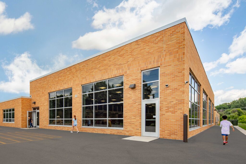 Danz Elementary School exterior of cafeteria with students walking outside