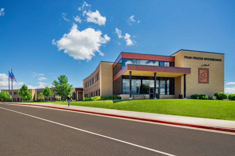 Fran Fruzen Intermediate School front/side entrance with school name and logo on building