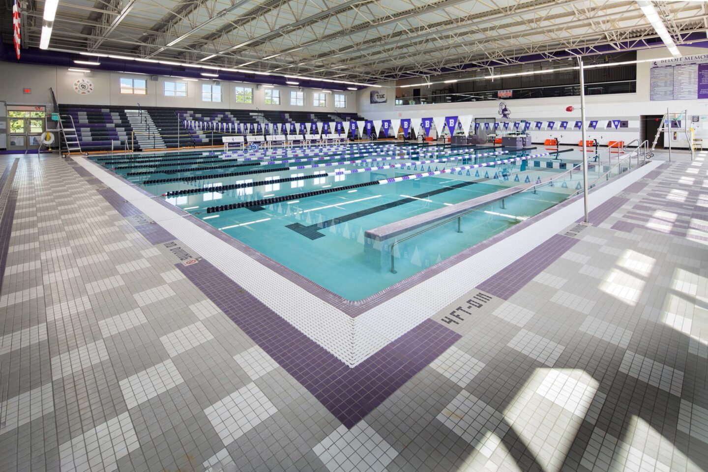 Beloit Memorial High School pool overlooking the pool, bleachers and second story seating visible