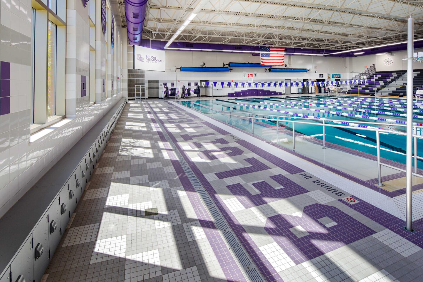 Beloit Memorial High School pool with ramp into water and lockers below the windows