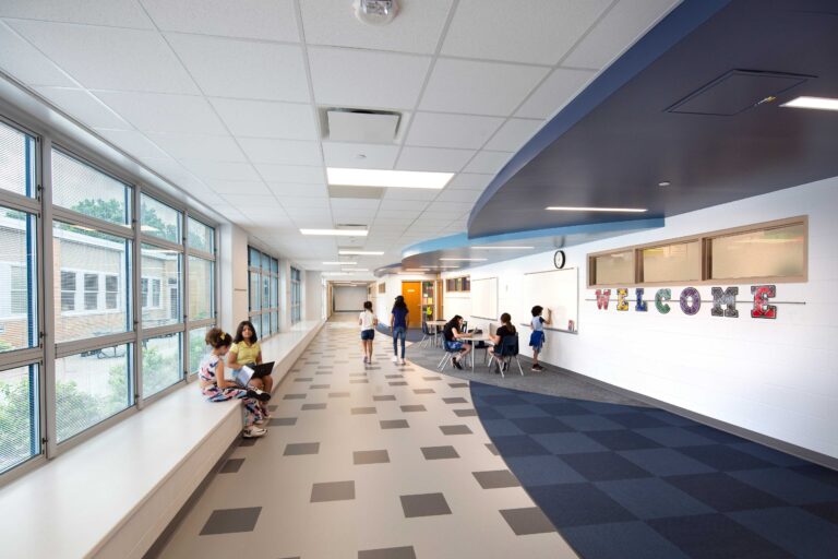 Danz Elementary School classroom collaboration hallway with students walking and sitting